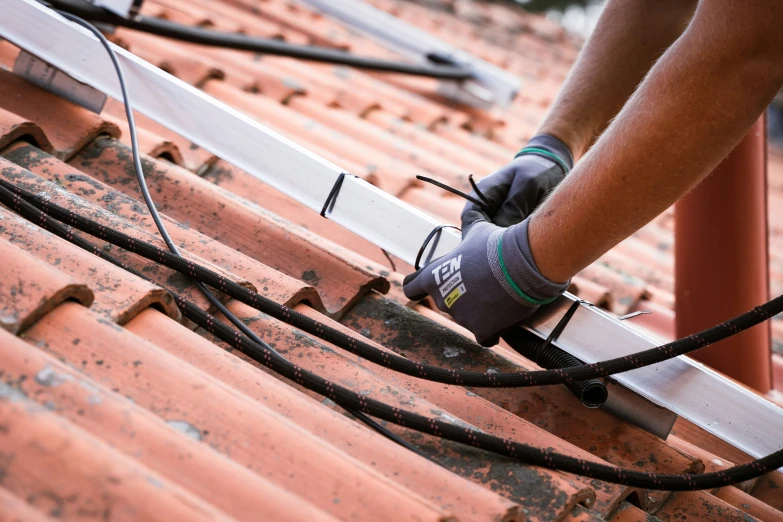 a man is installing tile on a building