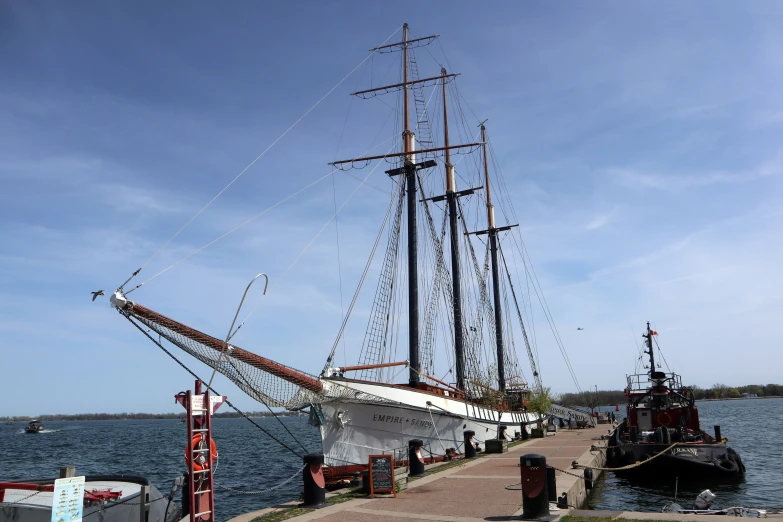 a boat docked next to a building by the water