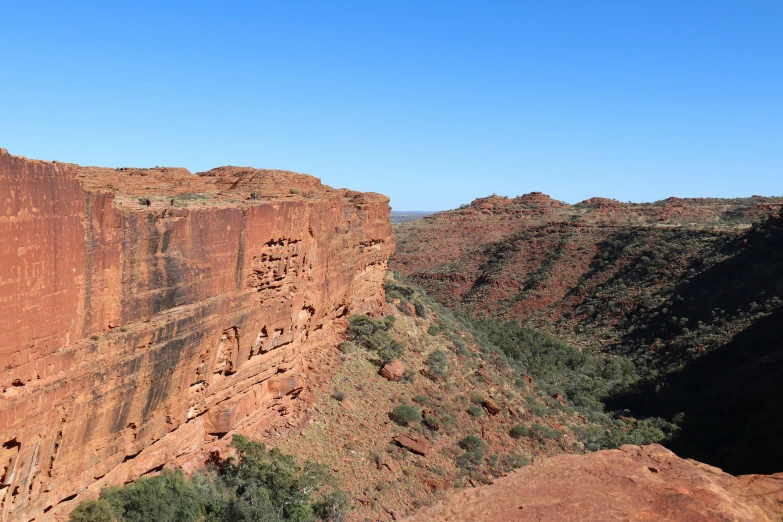 the edge of a rocky mountain area near the ocean