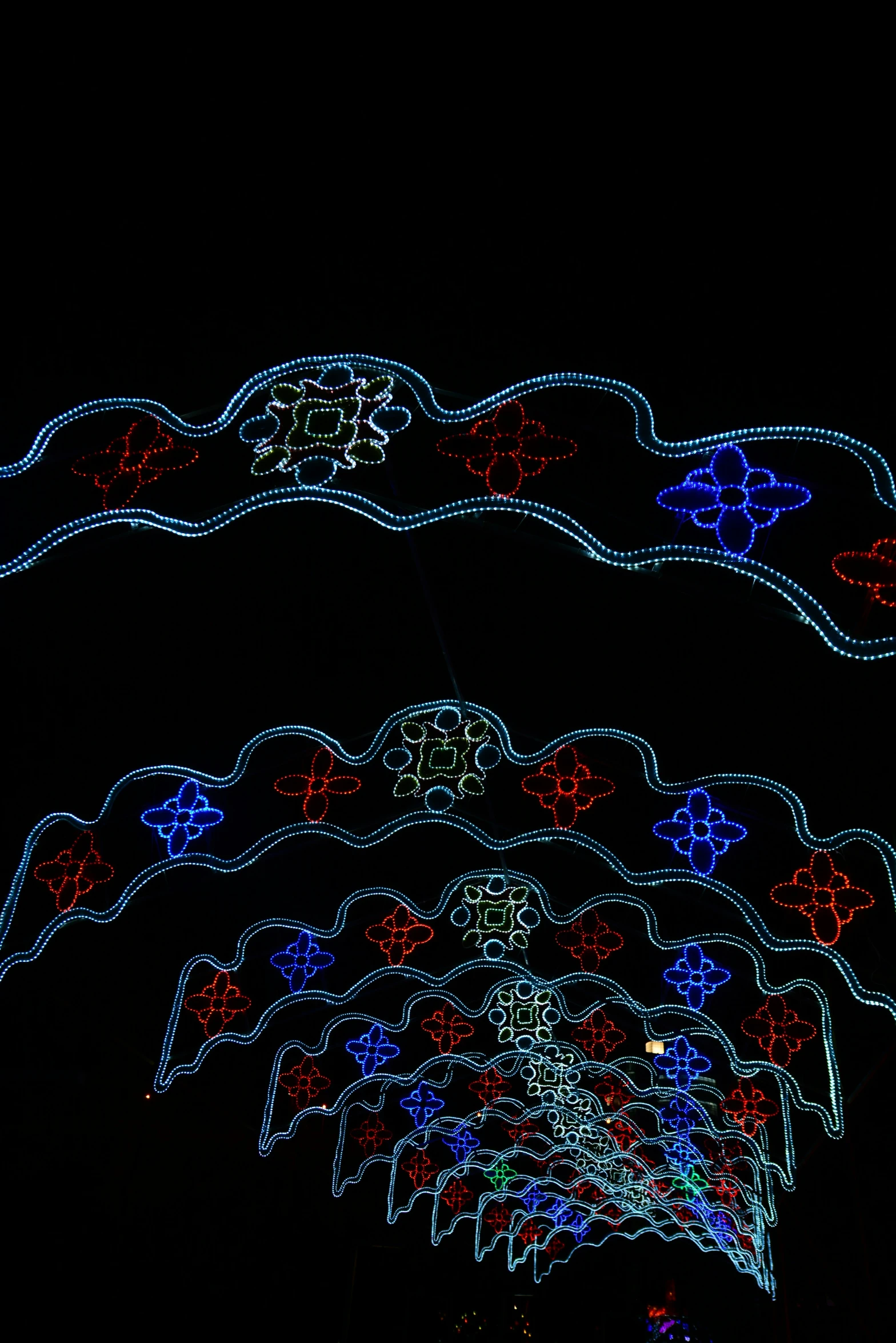 a black background with colored lights and designs on it