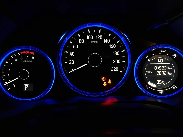 a close up view of a car dashboard and meter