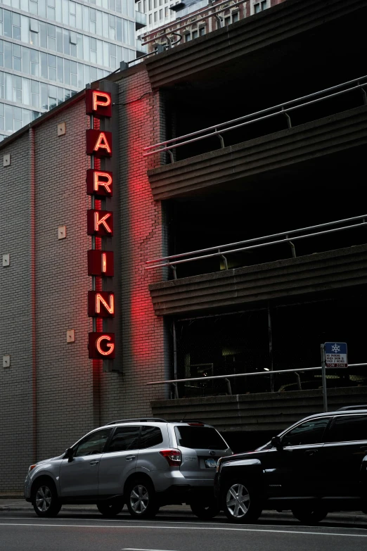 a parking sign on the side of a building