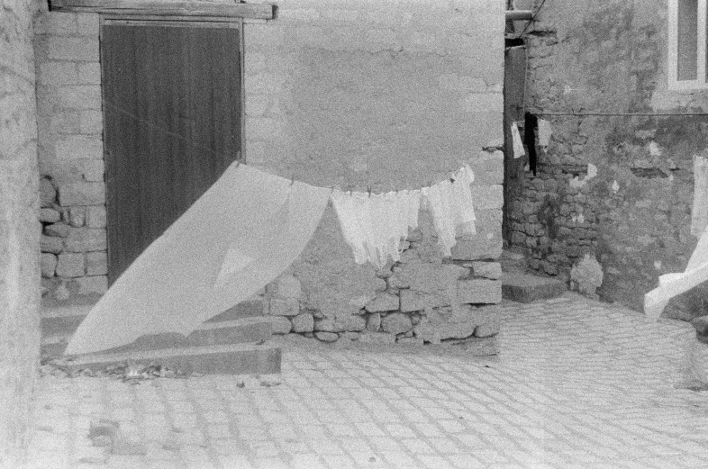 black and white image of clothes hanging on line