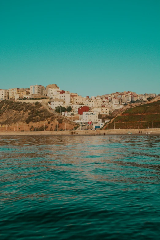 houses on a hill overlooking the ocean