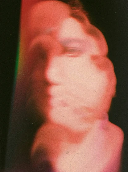 a blurry image of the head of a man