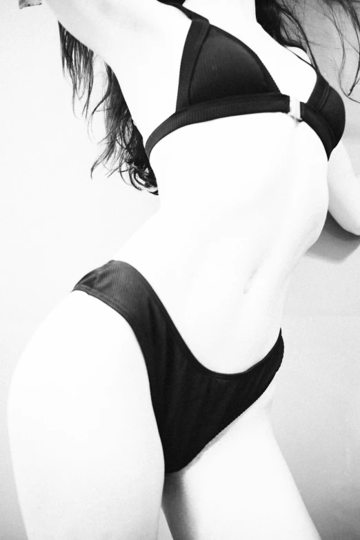 a beautiful woman in black and white bikini