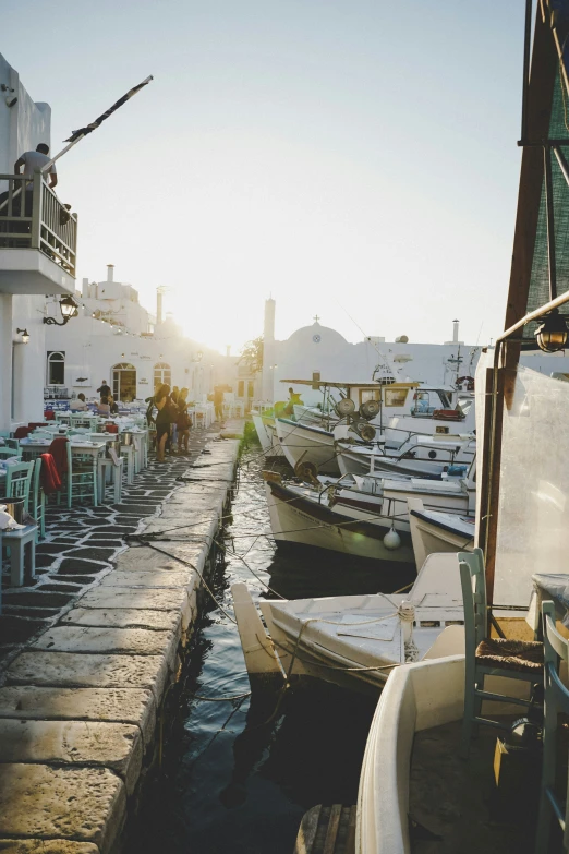 a dock with two rows of boats in front of it