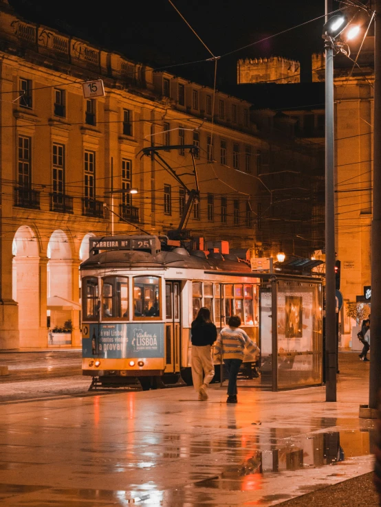 a trolley is in the city at night