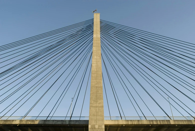 looking up at a bridge with an arched section