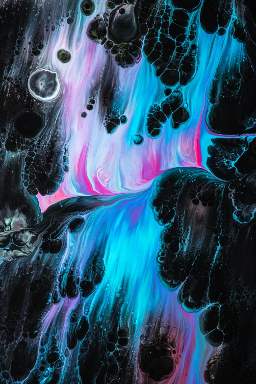 black and blue water flows out into a multi - colored landscape