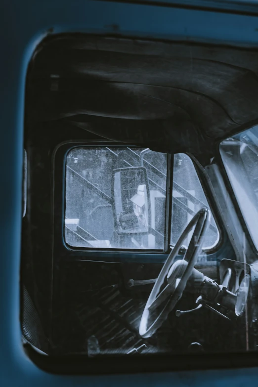 the front seat from inside a car with windshield and seat up