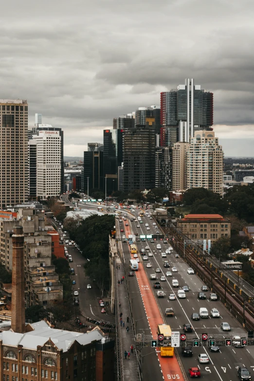 the view from the top of a building with vehicles passing by