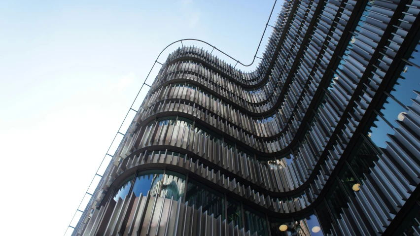 a tall building with many windows in front of it