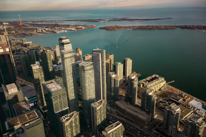 aerial view of large city with large body of water in the distance