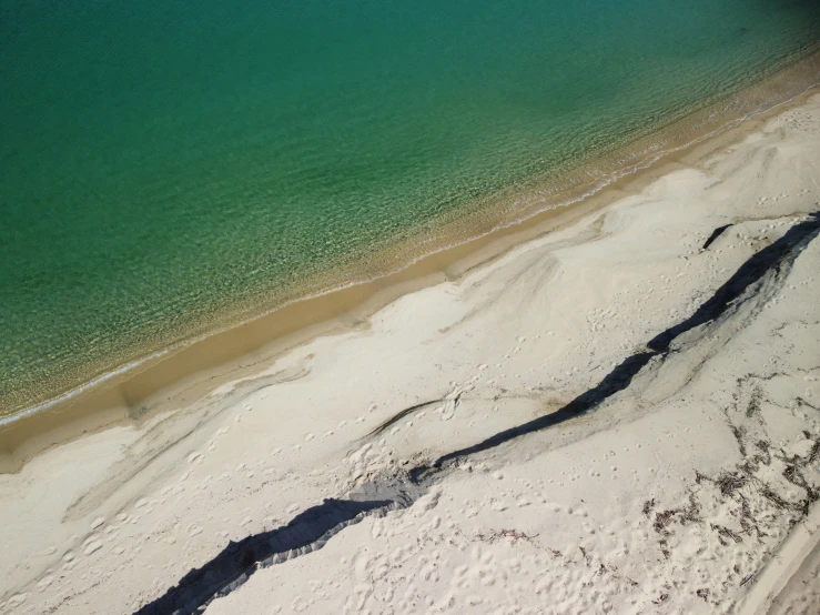 an aerial view of a beach in the ocean