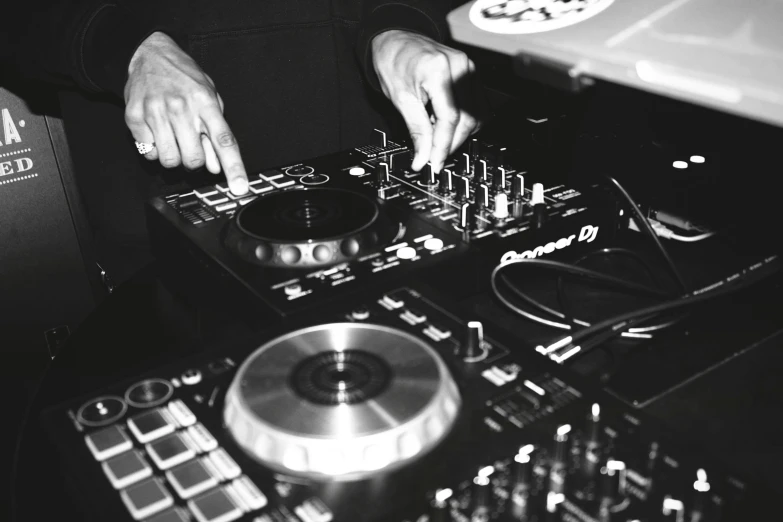 a man mixing some music at a party