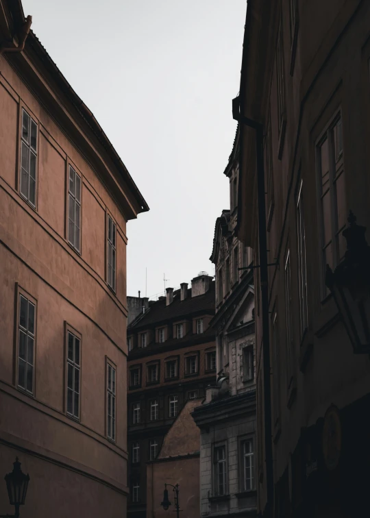 old city buildings line the sides of a street