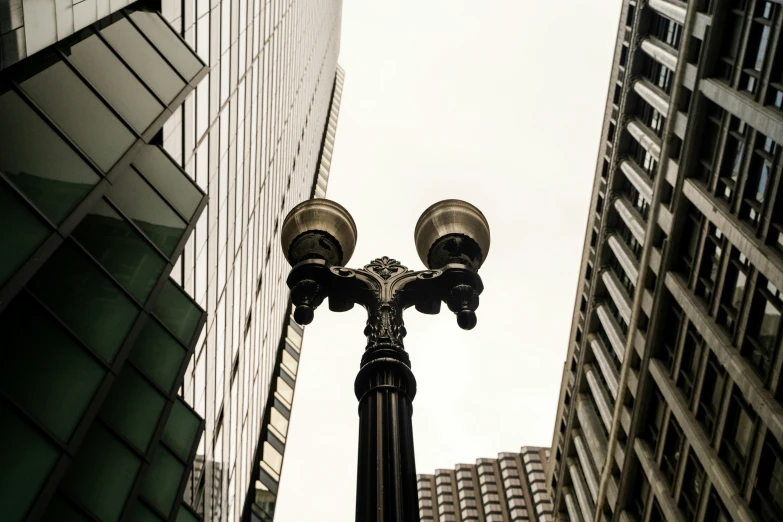 two street lamps stand in front of some building