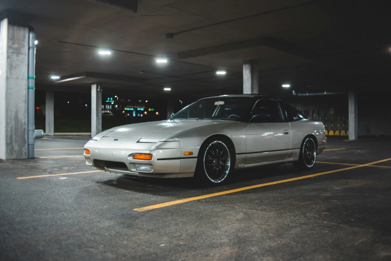 a car parked in a parking garage at night