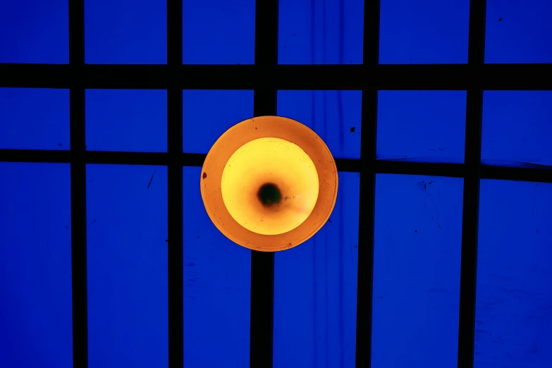 an orange horn is seen in between bars