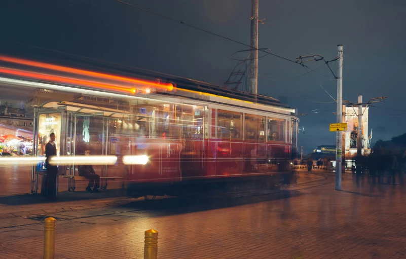 train passing by at night time on the tracks