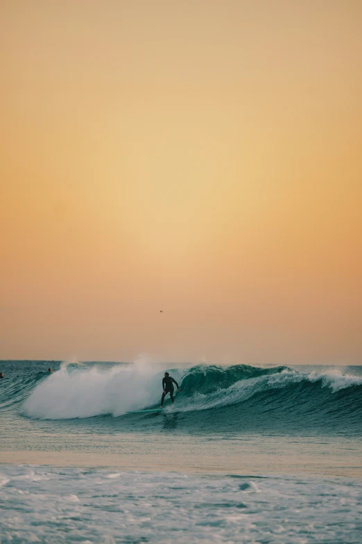 a surfer is surfing the wave in the ocean