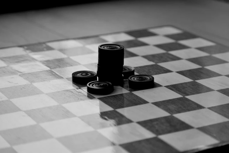 three rolling dice sit on top of a chessboard