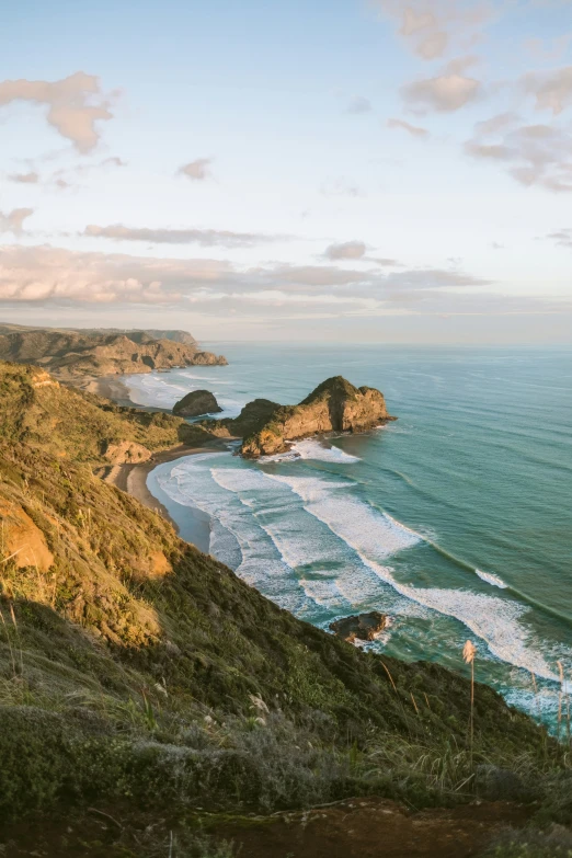 view of ocean with many hills near shore