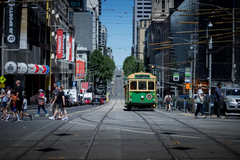 a trolley car passing through the streets of a city