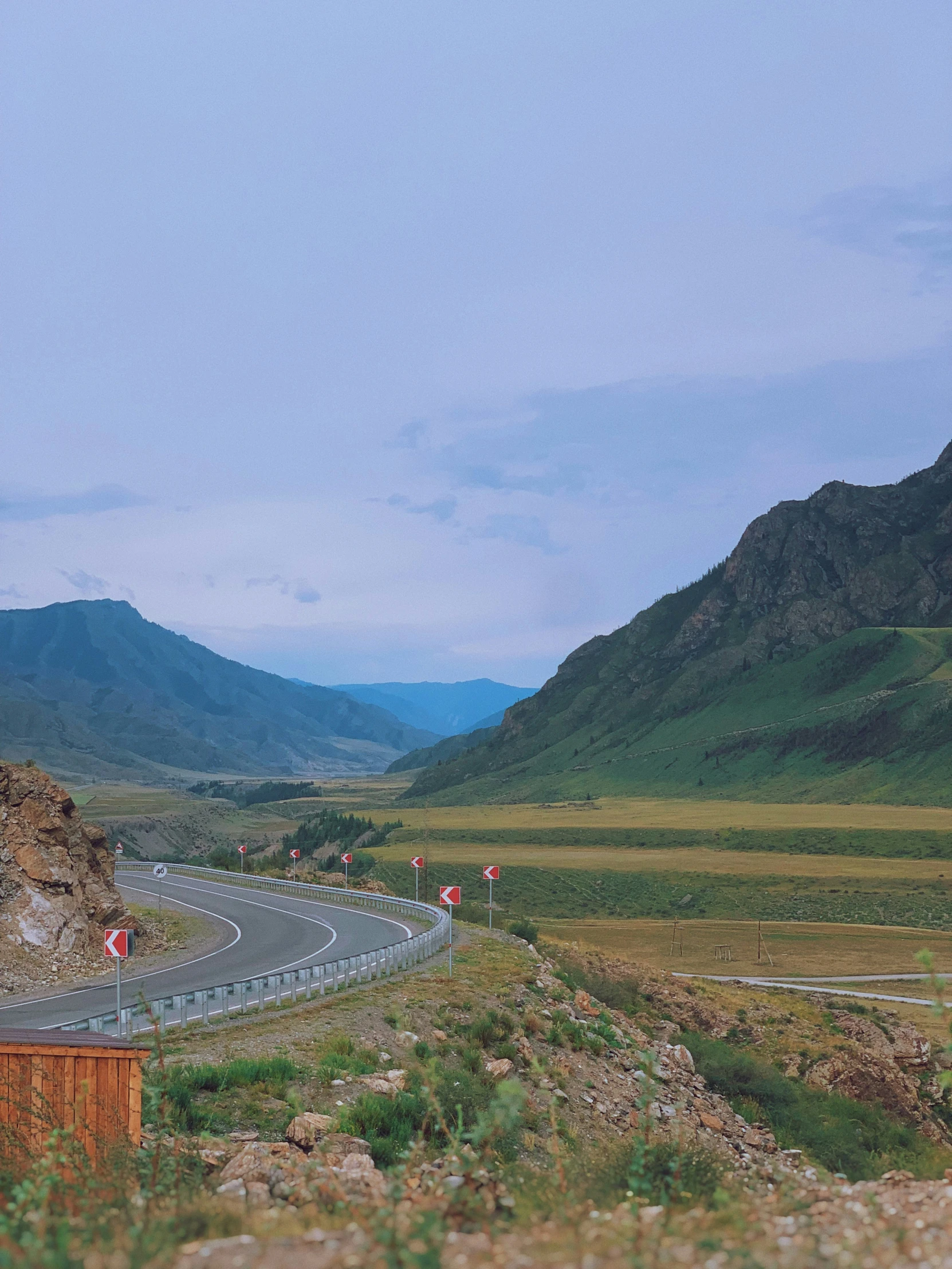 a freeway with mountains in the background