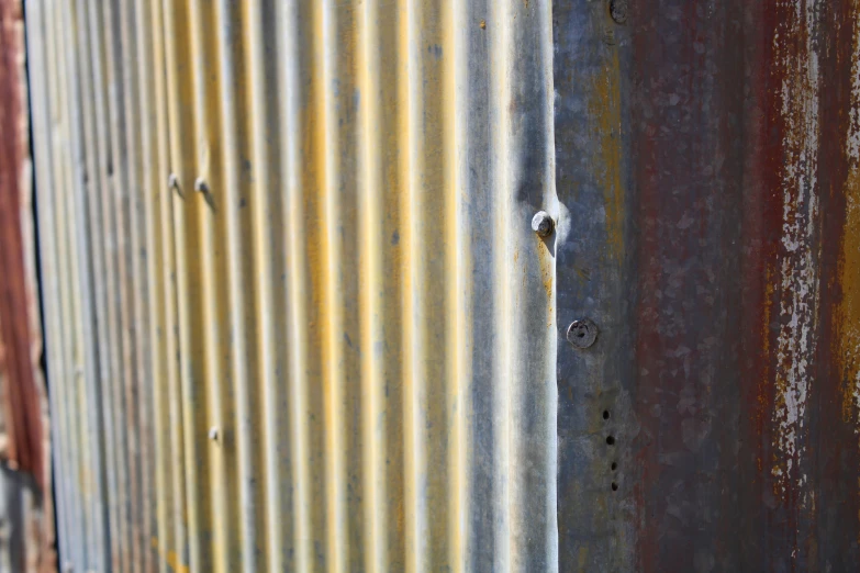 rusty corrugated sheet that is peeling with little rust