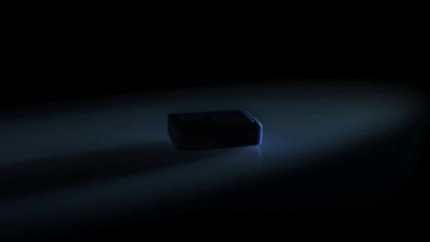 an empty cellphone sitting in the dark