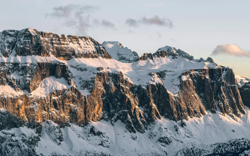 the majestic snow capped mountains are seen from an airplane