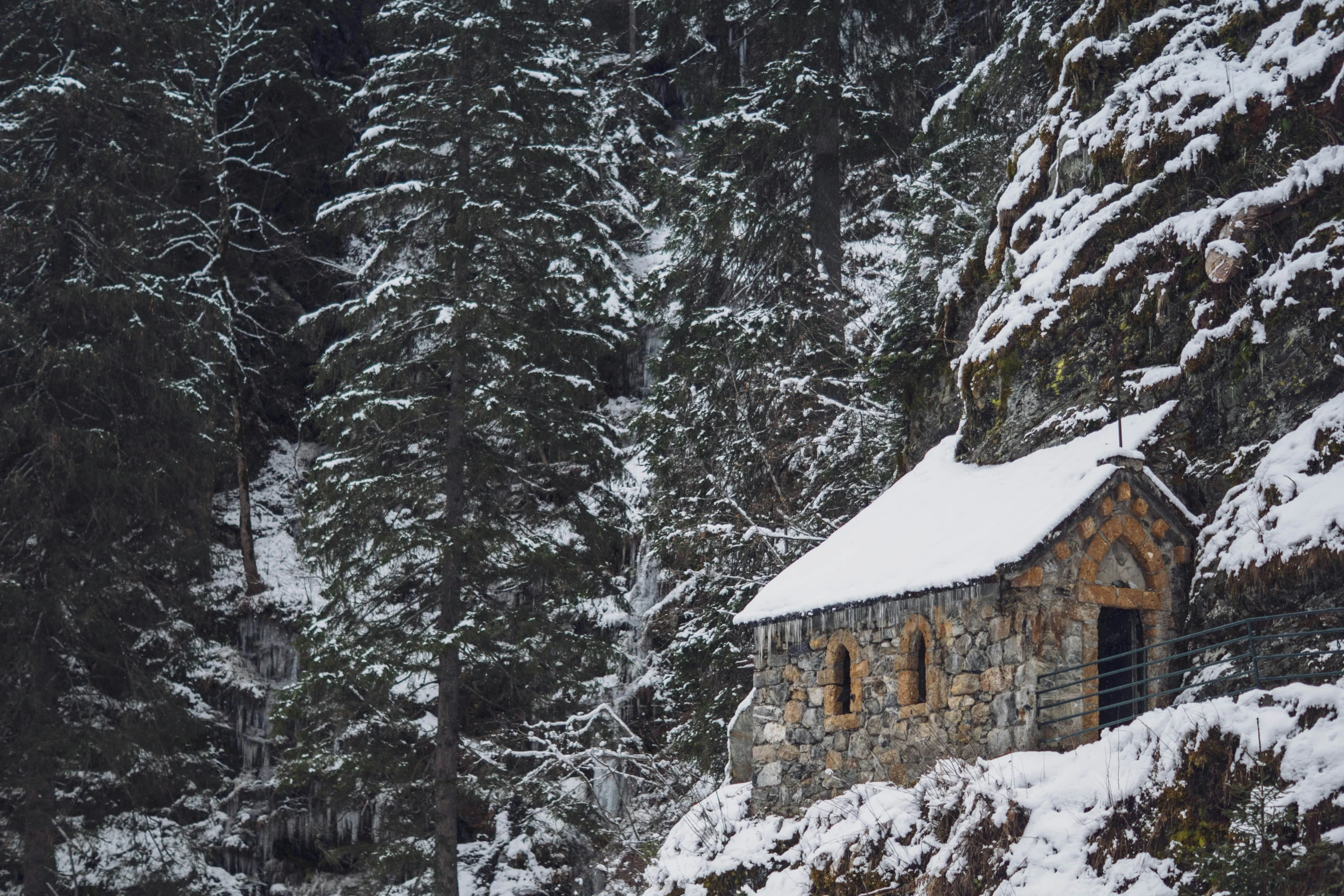 a large snow covered building on a hill