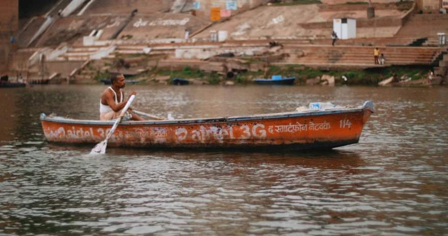 a man in his boat with words on it