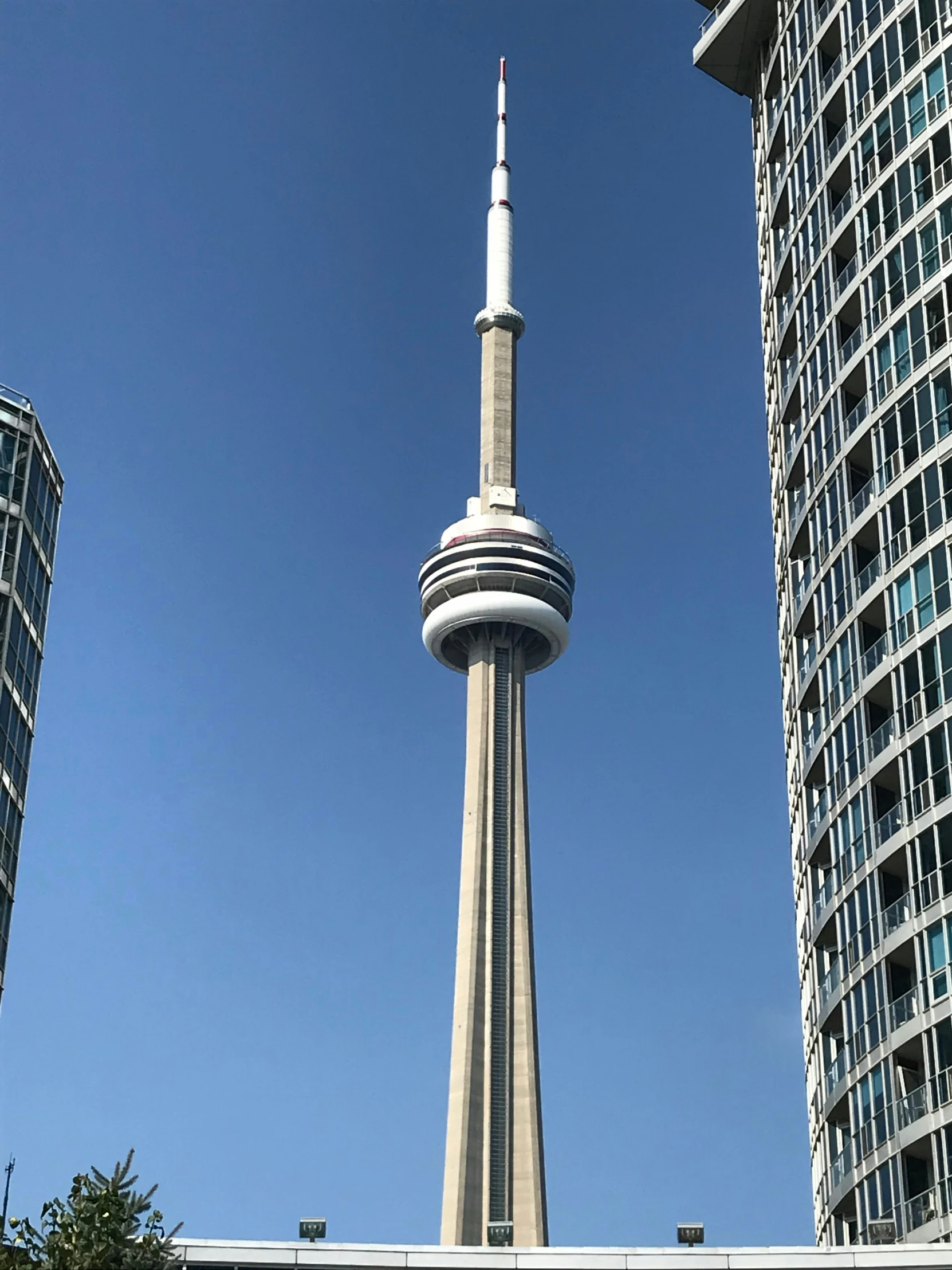 a view of a tall spire and surrounding buildings