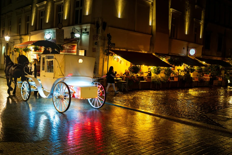 a small carriage sitting next to a sidewalk