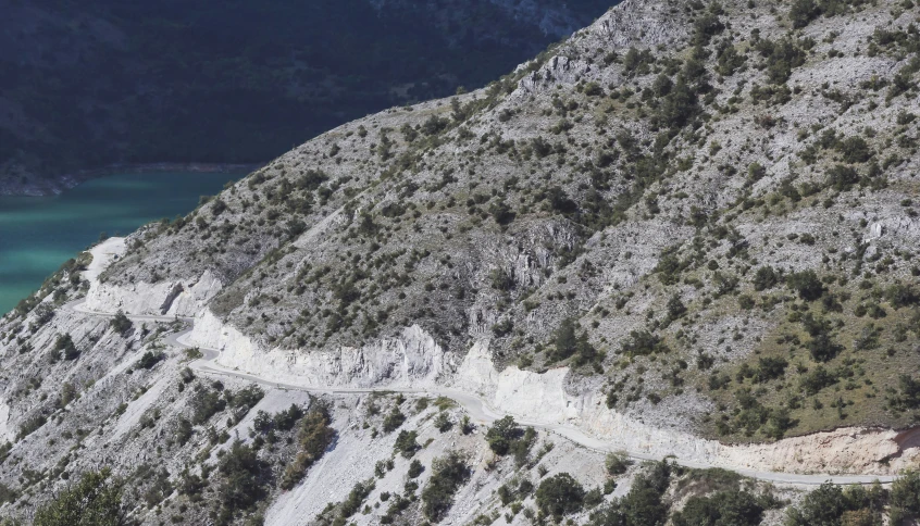 a winding road along the side of a mountain