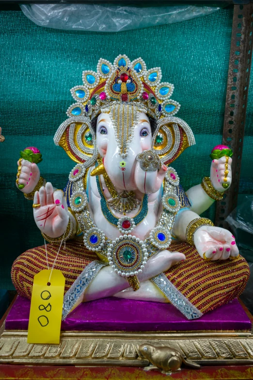 a colorful and elaborately decorated elephant statue