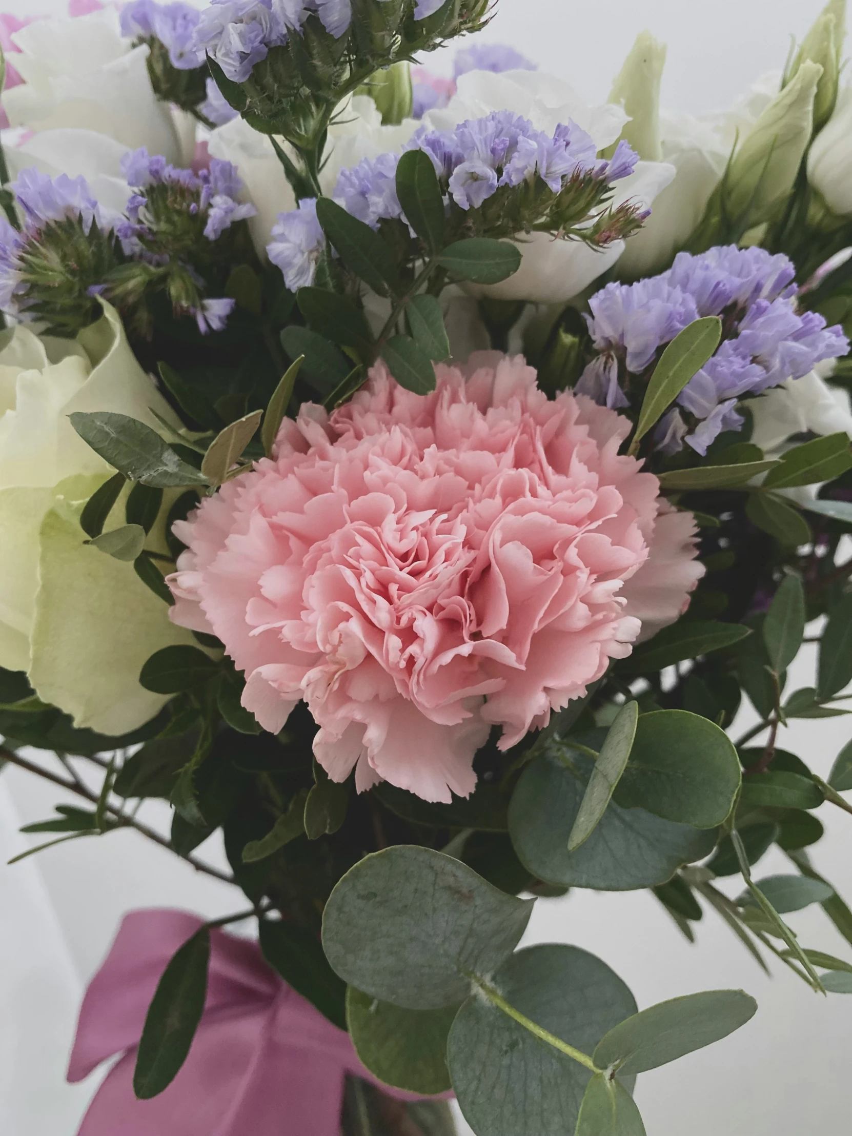 a bouquet of flowers sitting inside of a vase