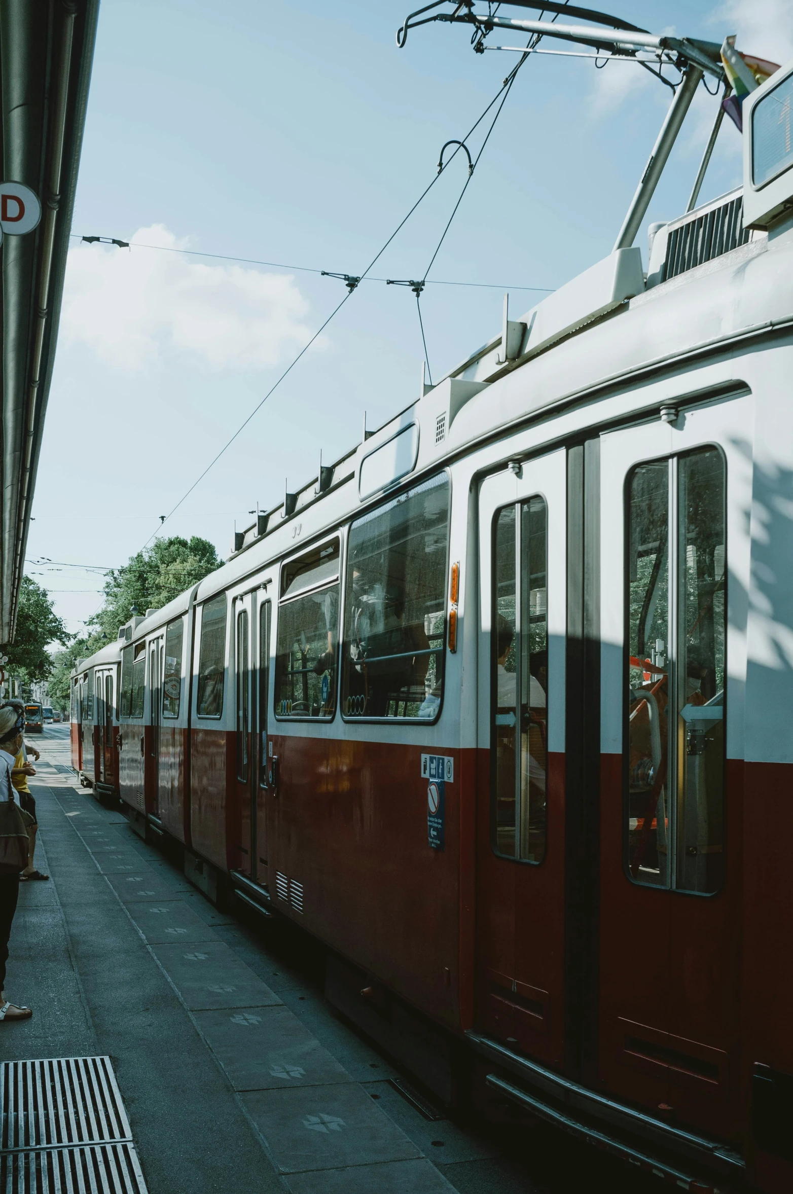 a passenger train on the tracks at a station