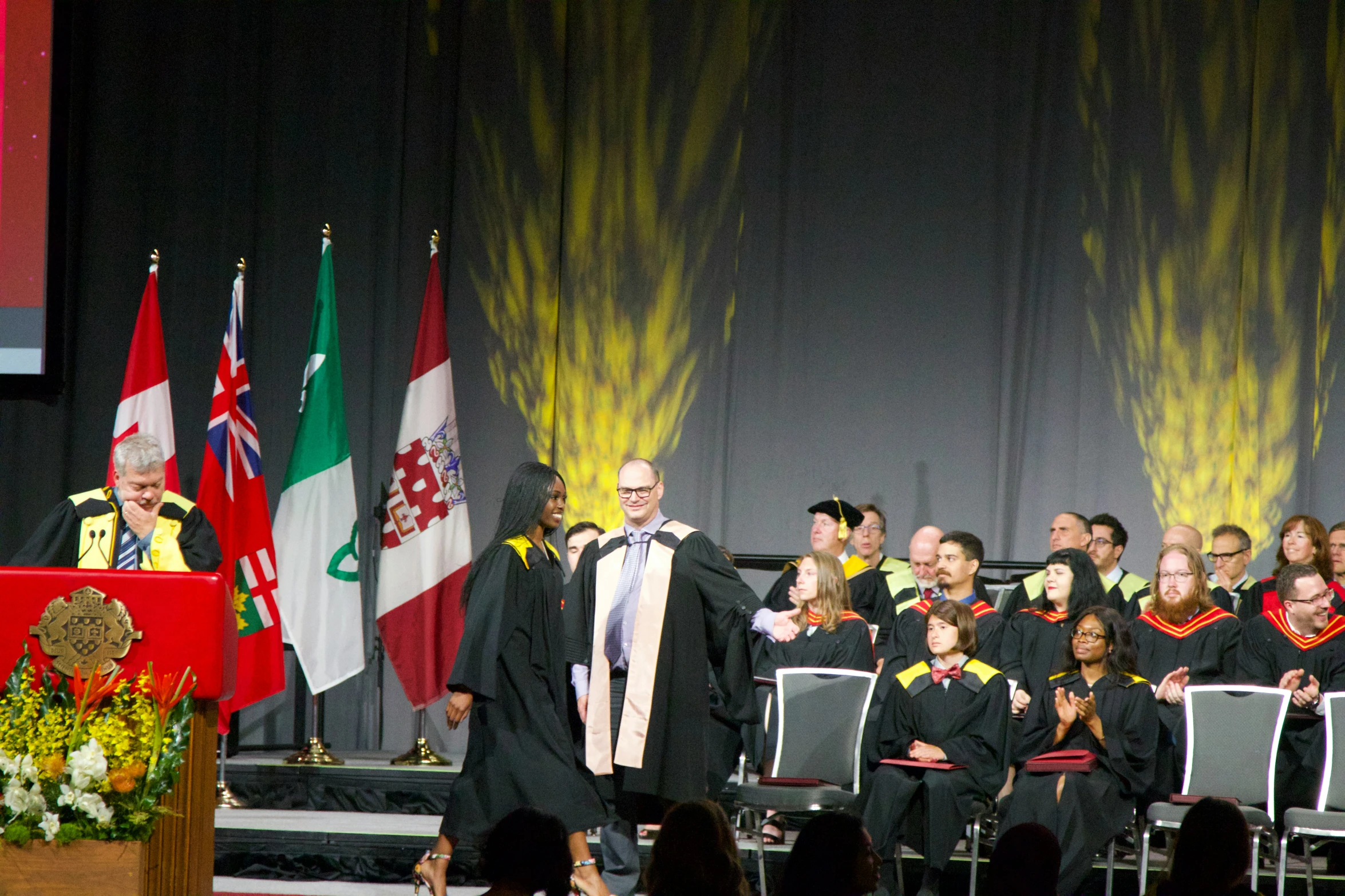 the ceremony in which graduates receive their degrees and certificates