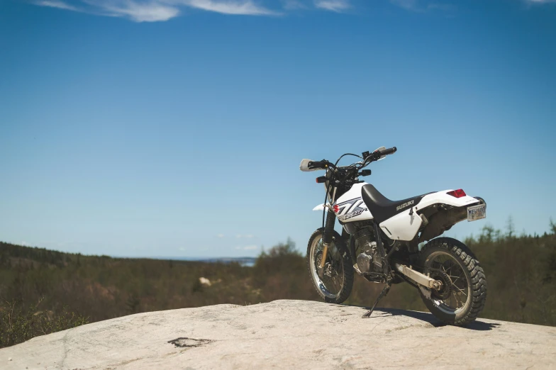 there is a motorcycle parked on top of a mountain