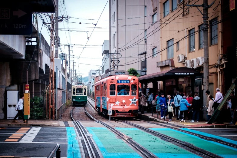 a commuter train leaving the station at an outdoor depot