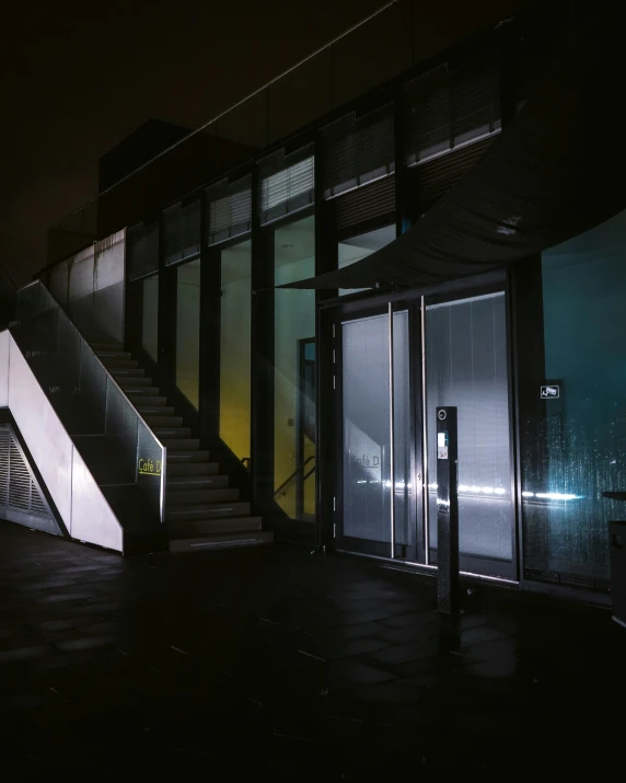 a night time scene showing the side entrance of an airport