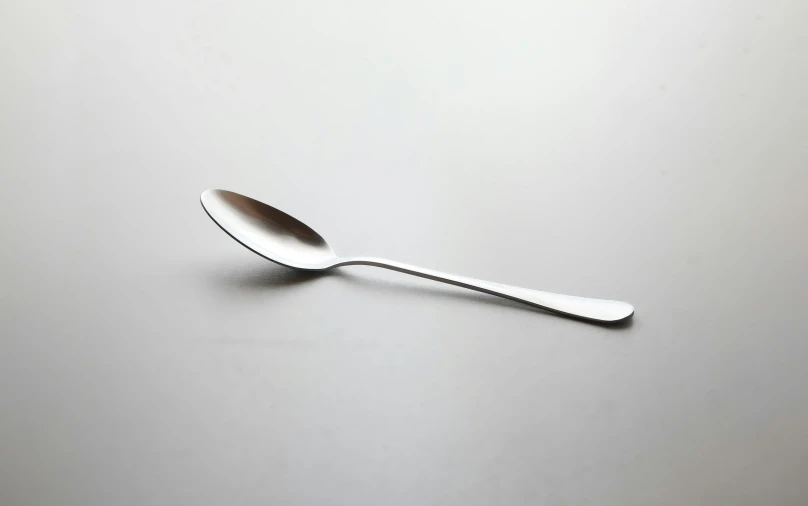 an aluminum spoon with a fine metal handle