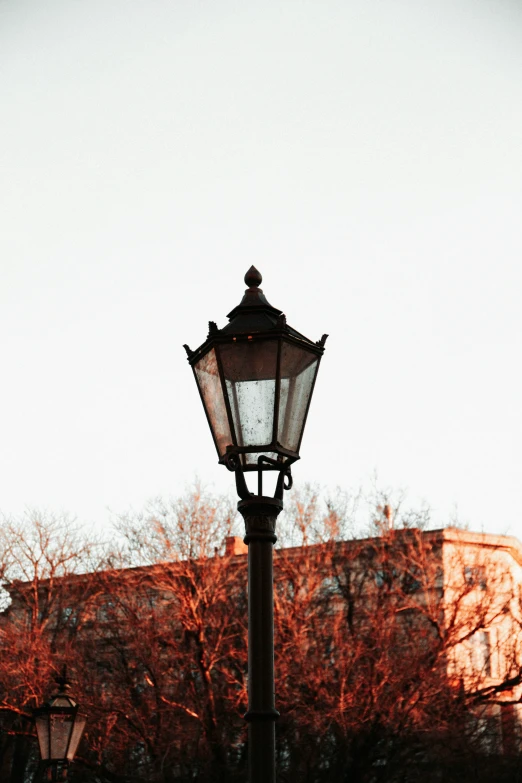 a street lamp on the side of a building