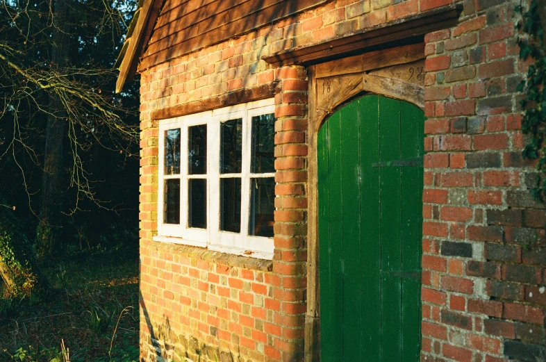 a red brick building with two doors and windows