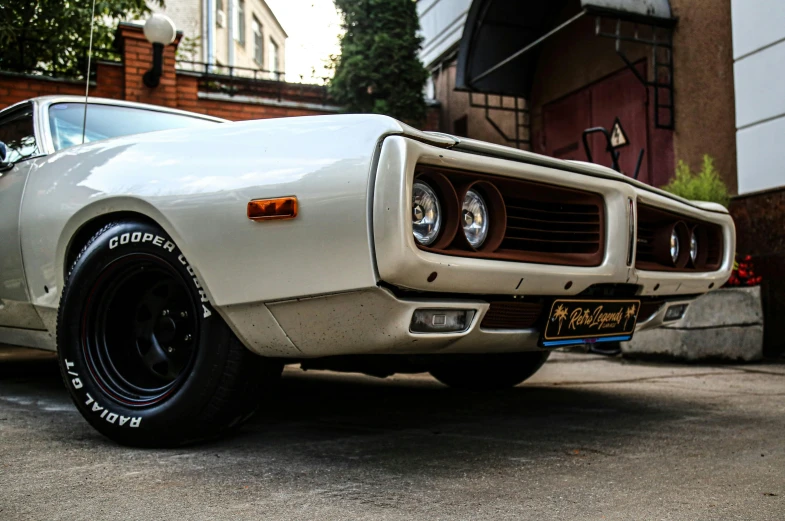 an old muscle is parked in a parking lot