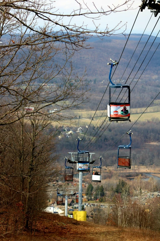a couple of lift lifts going over a hill
